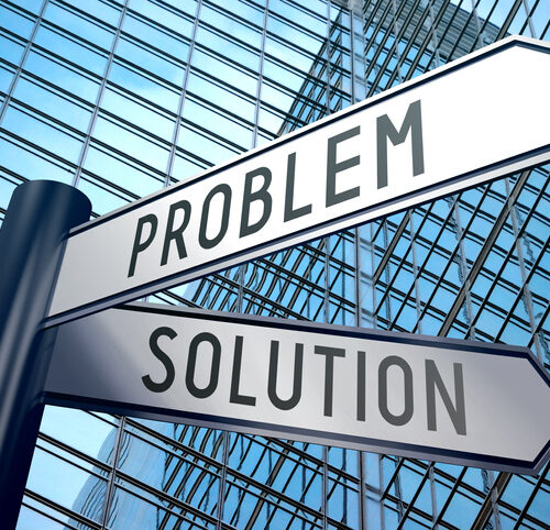 Crossroads sign with two arrows, office building - problem and solution